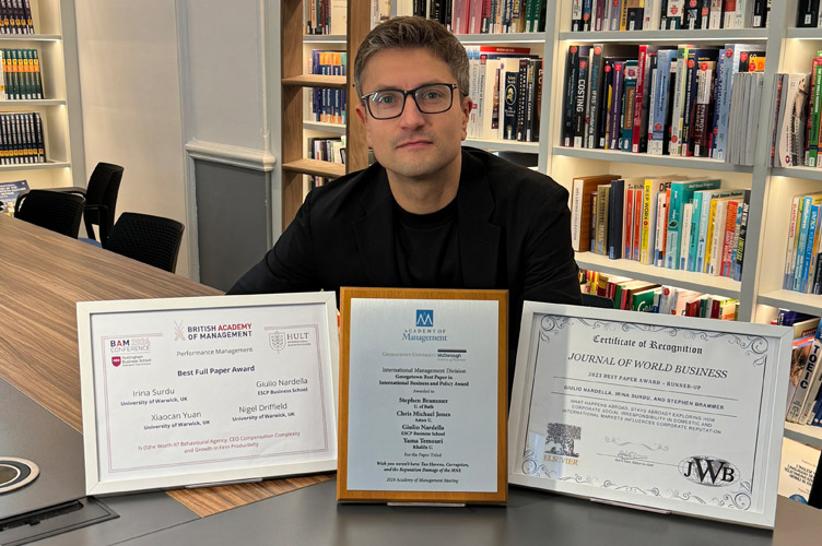 Picture: Prof. Giulio Nardella with his research awards