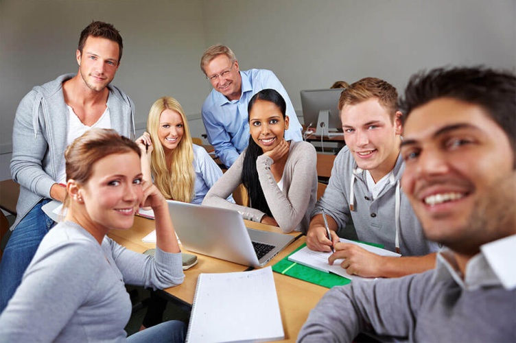 Office coworkers smiling and working together, ESCP